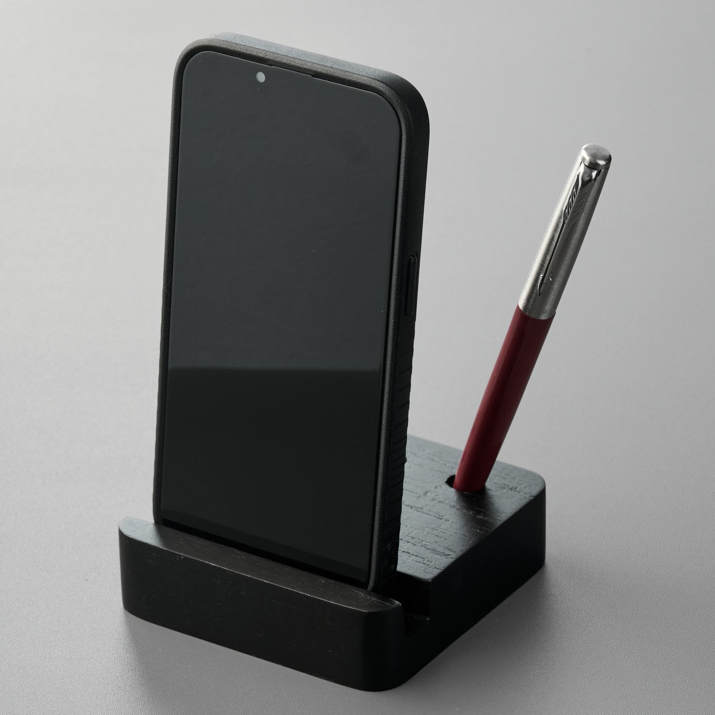 Black Pen and Phone Stand