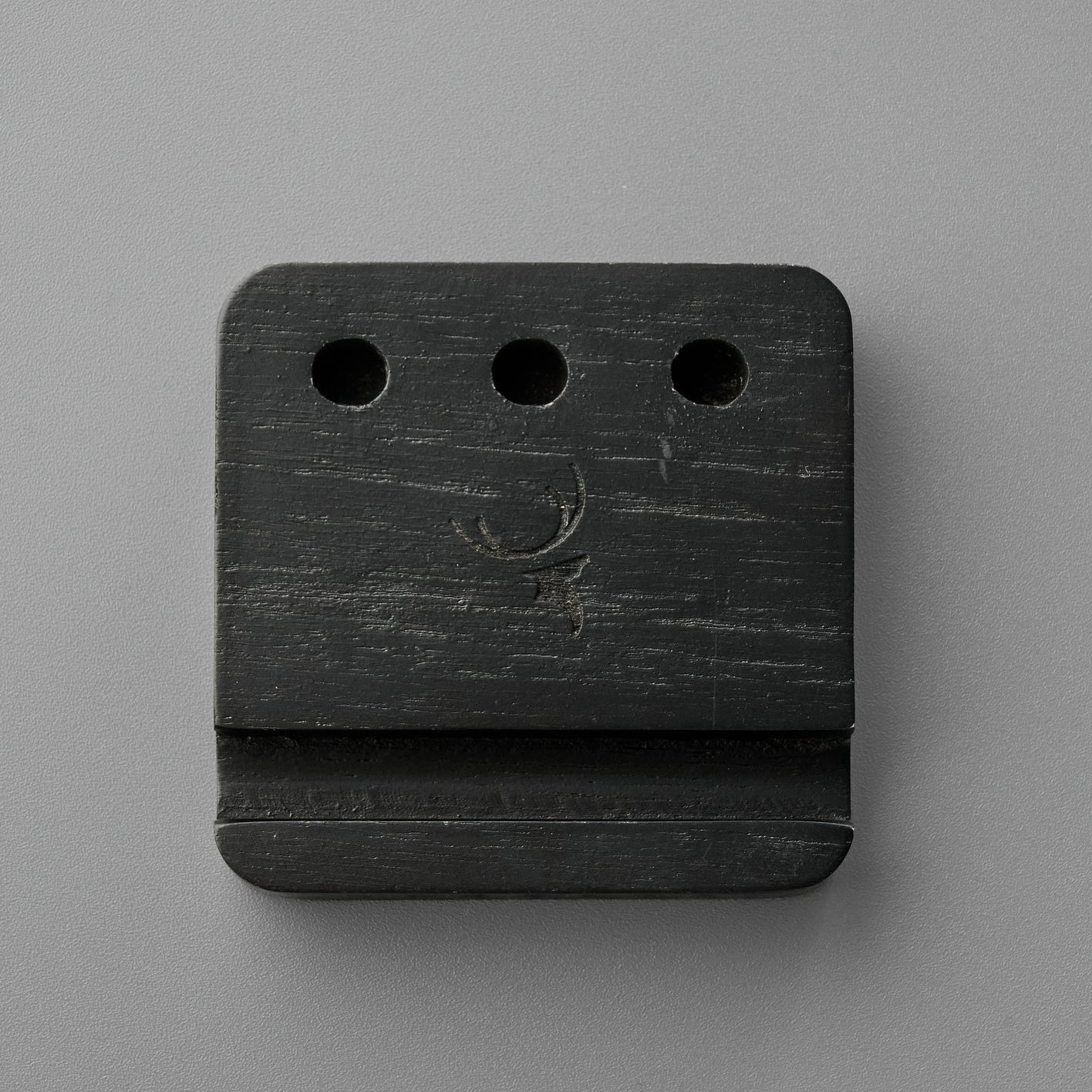 Black Pen and Phone Stand